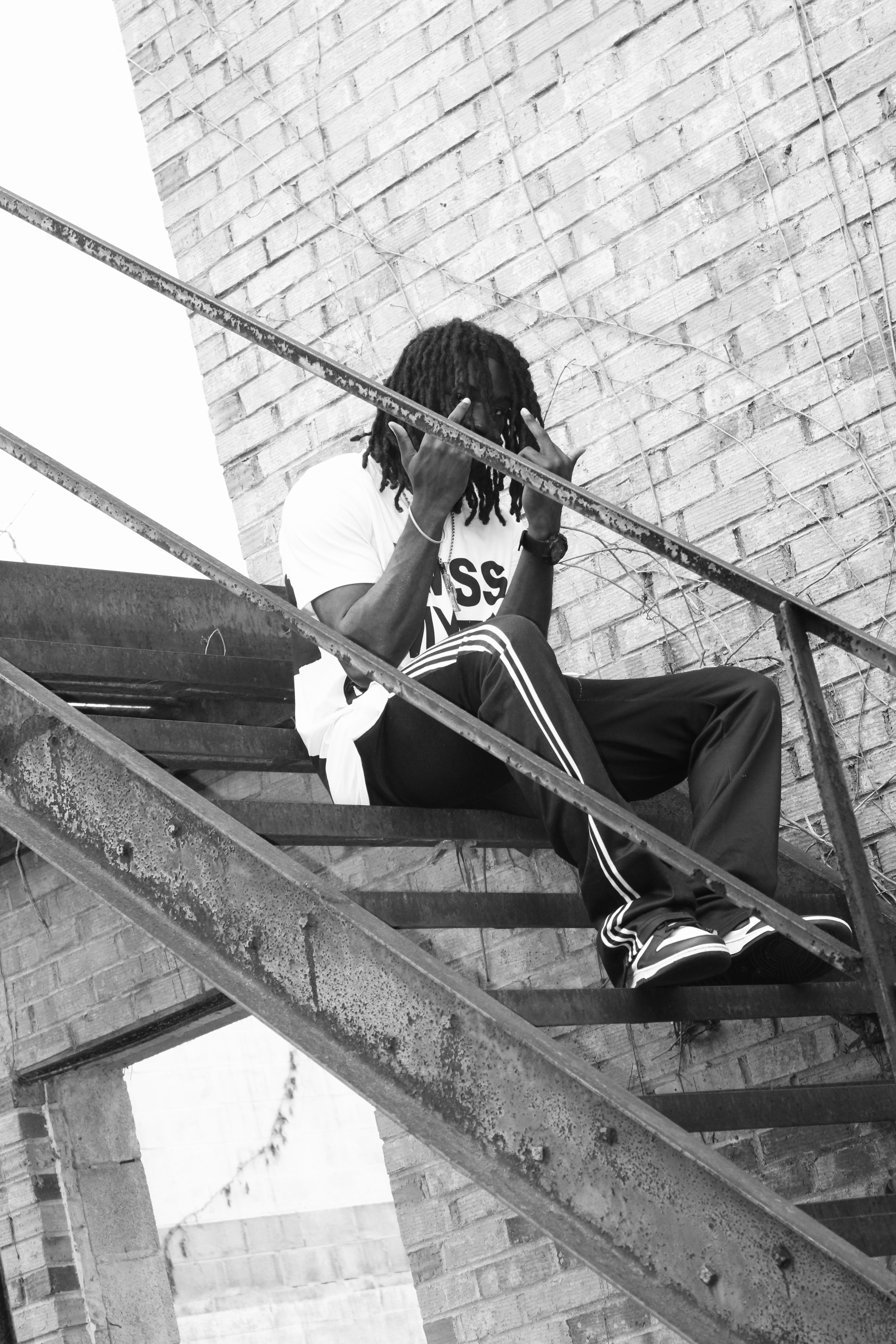 BigDeuceFOF staircase against a brick wall, promotional black and white photo for FOF Records in Columbia, South Carolina.